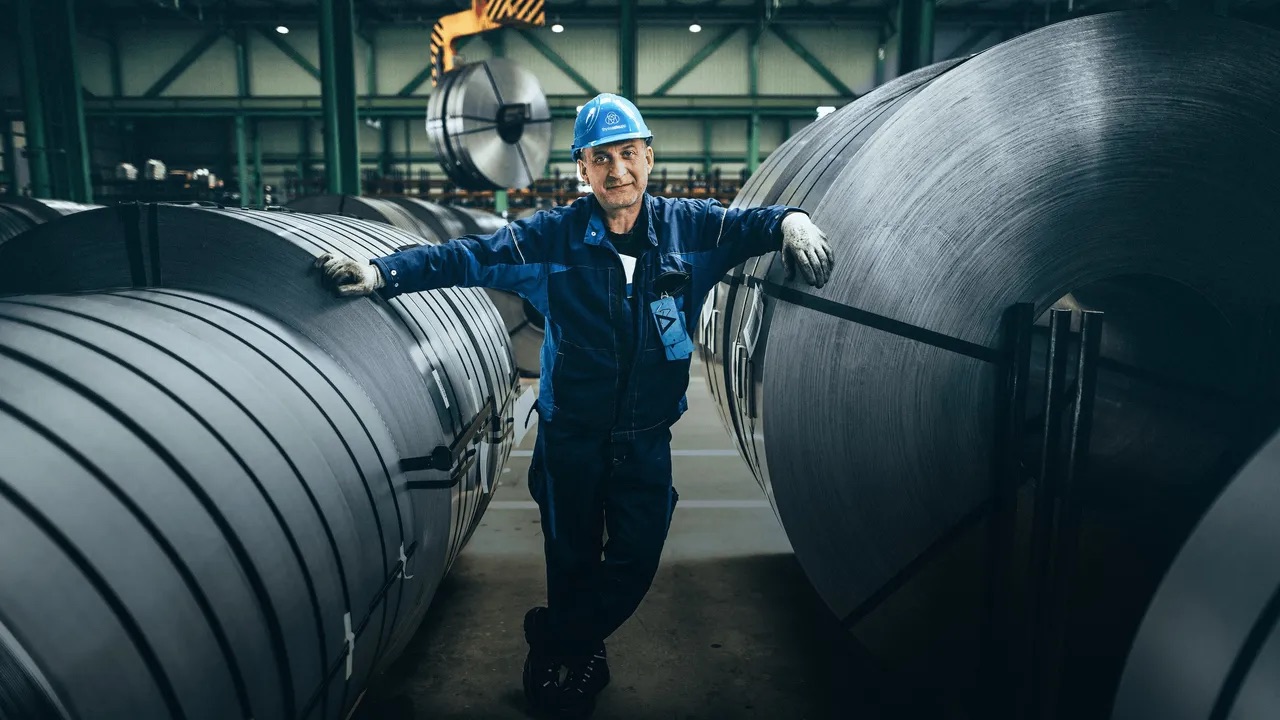Industrial Worker with Steel Coils